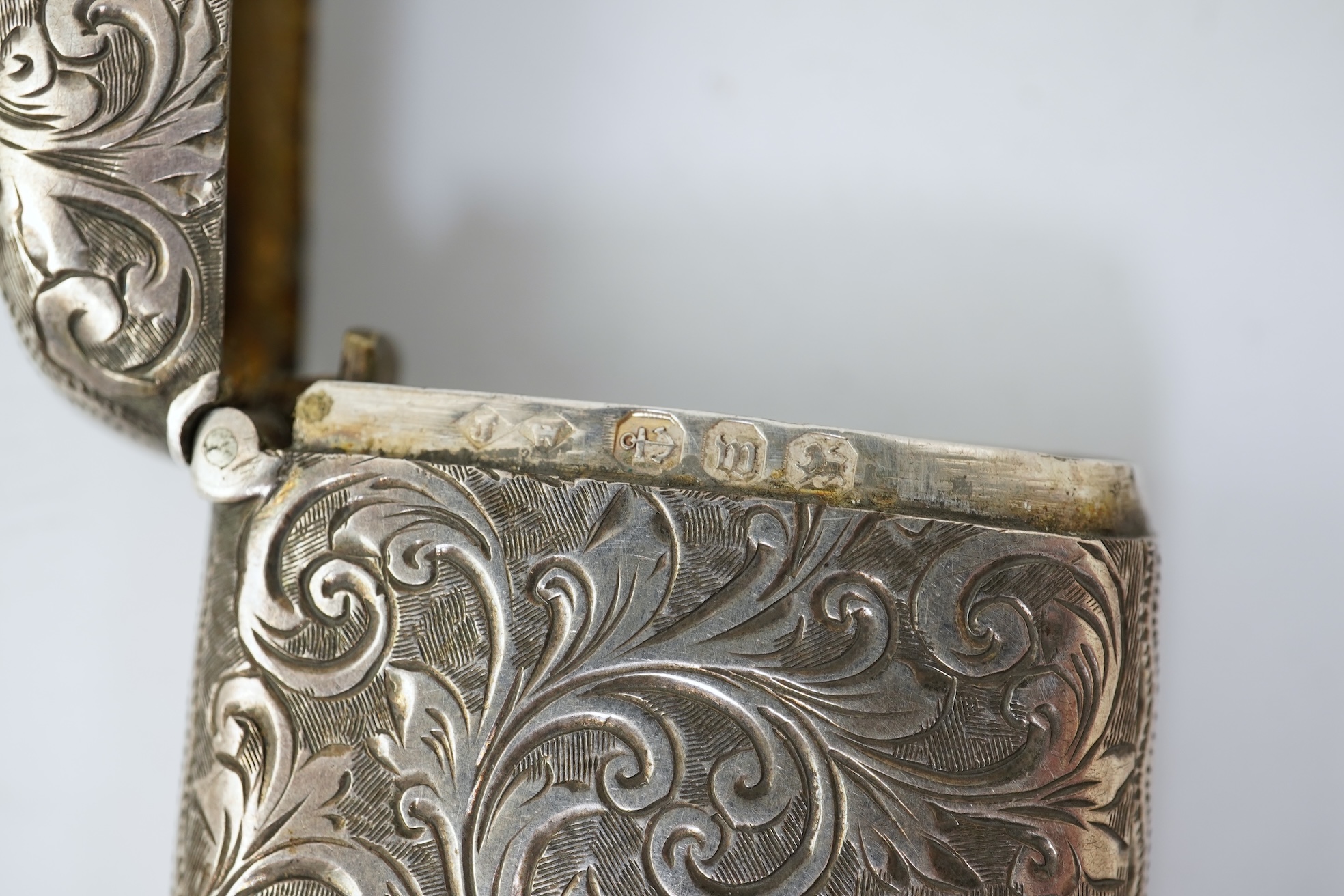 A late Victorian engraved silver oval combination sovereign and vesta case, by JW